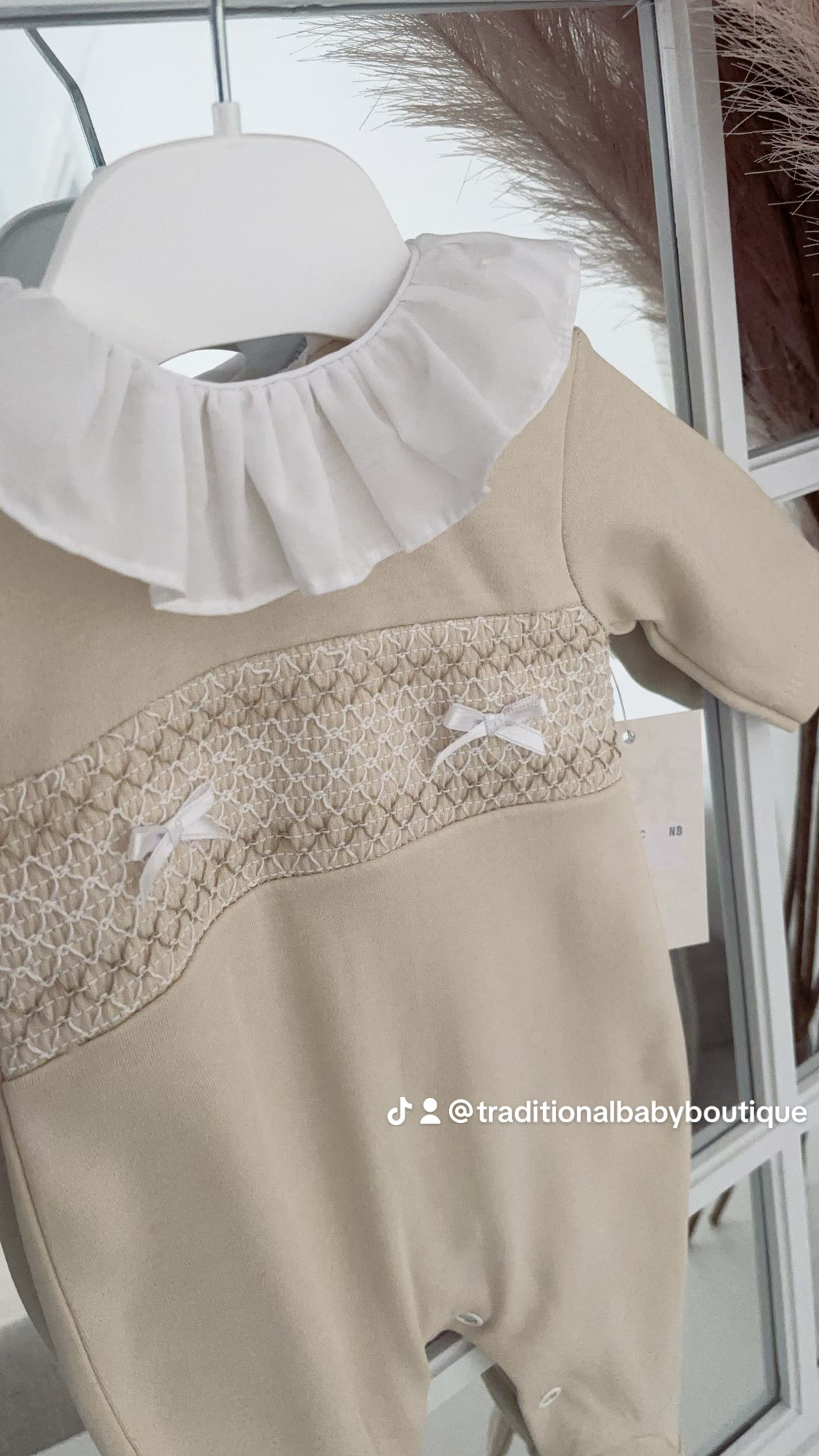 Baby girls smocked all in one with frilled collar