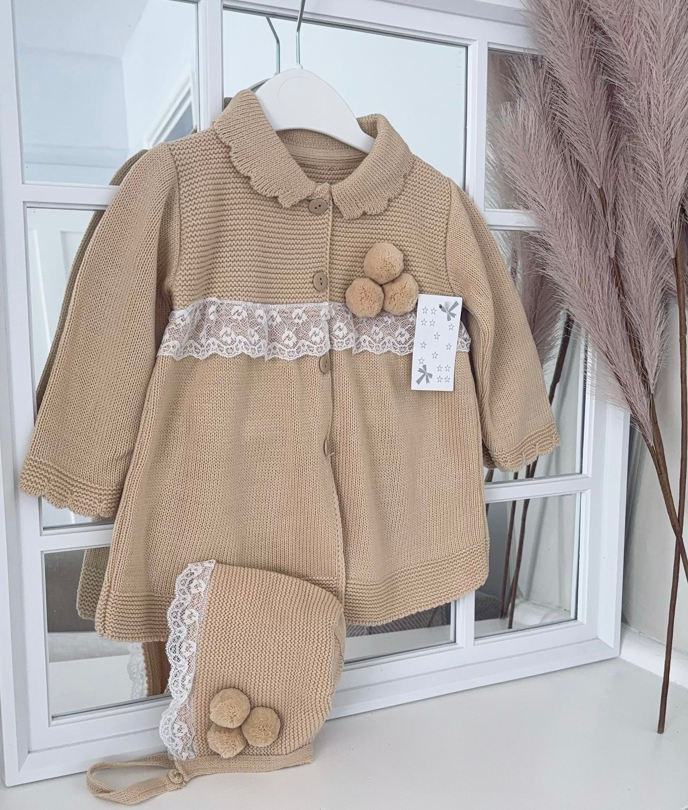 Baby girls knitted coat & bonnet with lace and pompoms