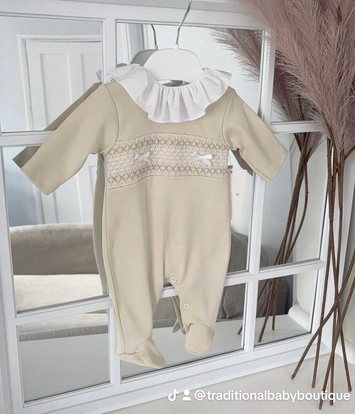 Baby girls smocked all in one with frilled collar